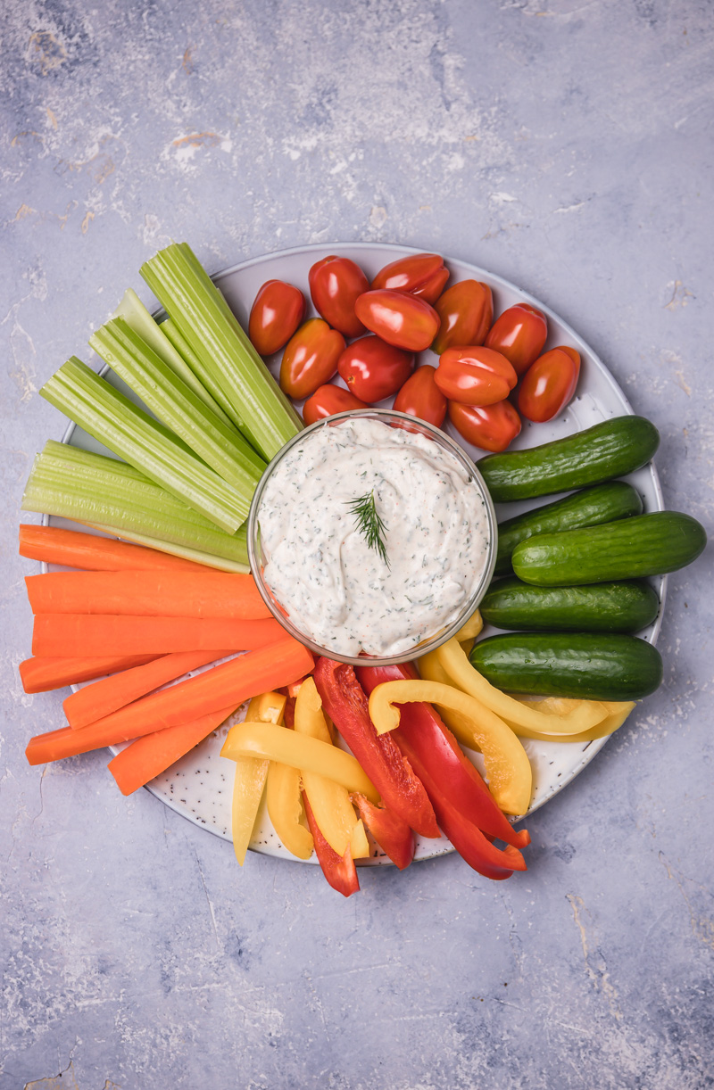 overhead shot of a vegetable platter with dip.