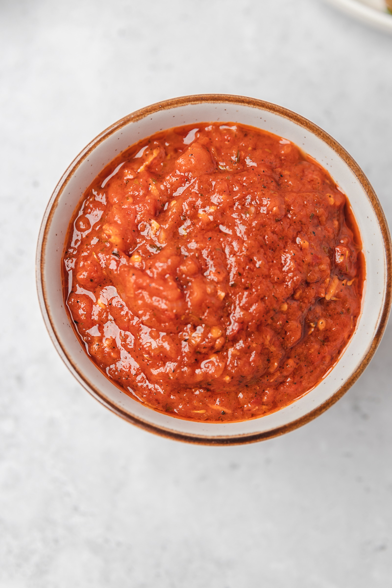 the overhead shot of tomato sauce in a bowl.