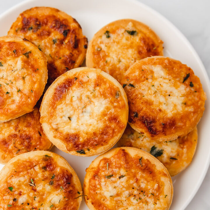 mini pizzas on a plate.