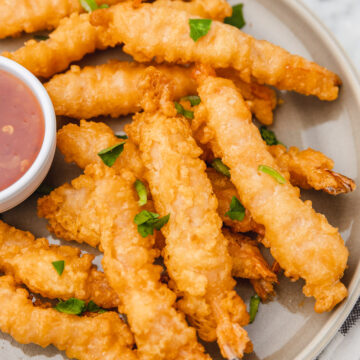 air fryer tempura shrimp on a plate.