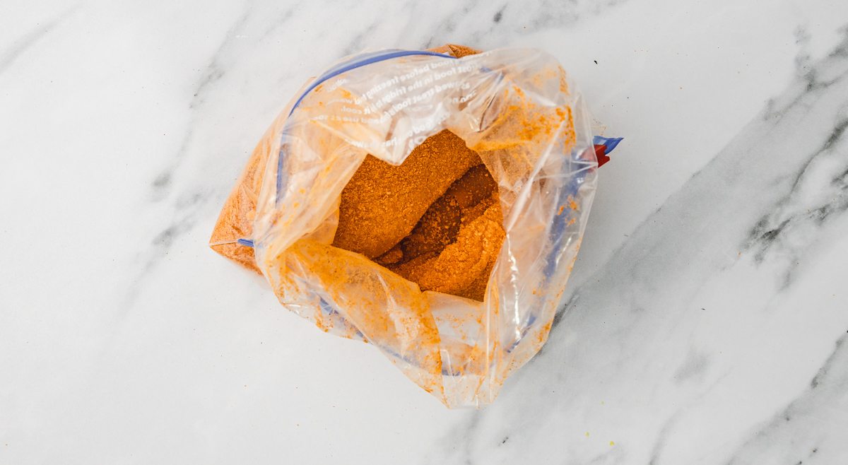 seasoned chicken breast in a ziploc bag.