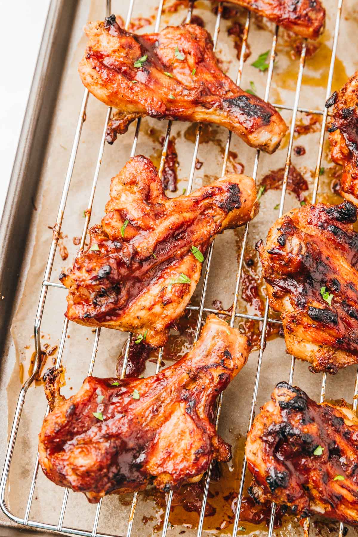 cooked chicken bbq butterflied chicken on cooling rack.