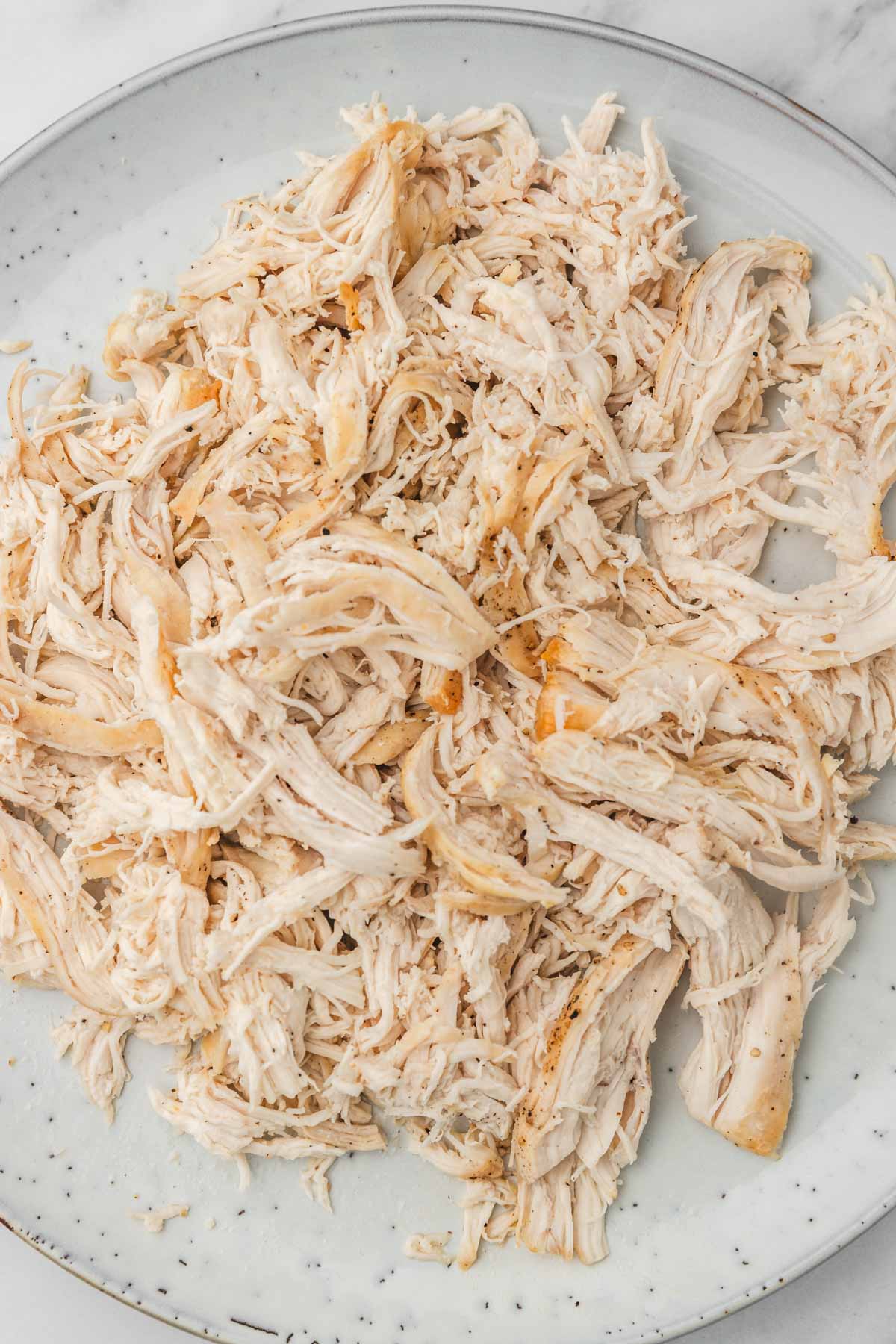 shredded chicken on a plate.