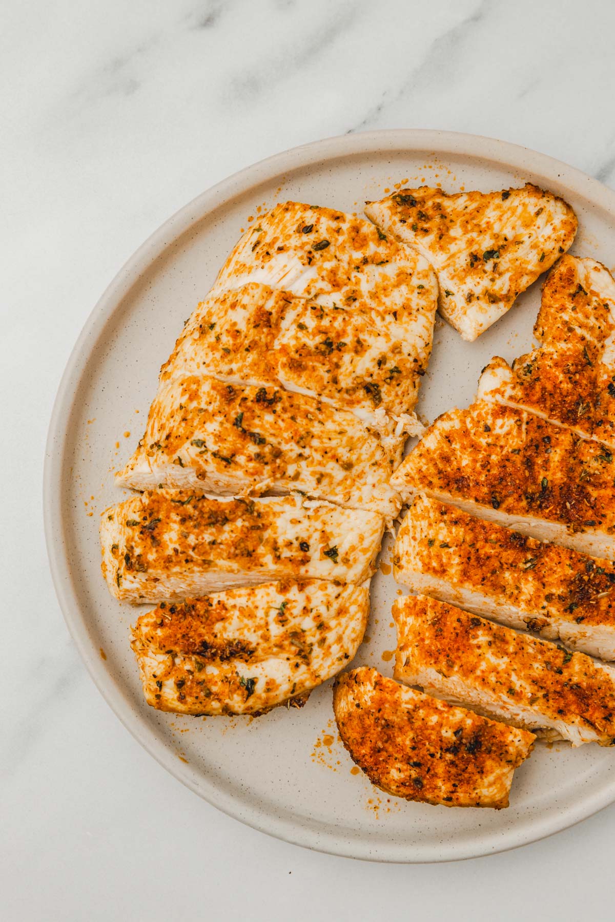 sliced chicken breast on a plate.