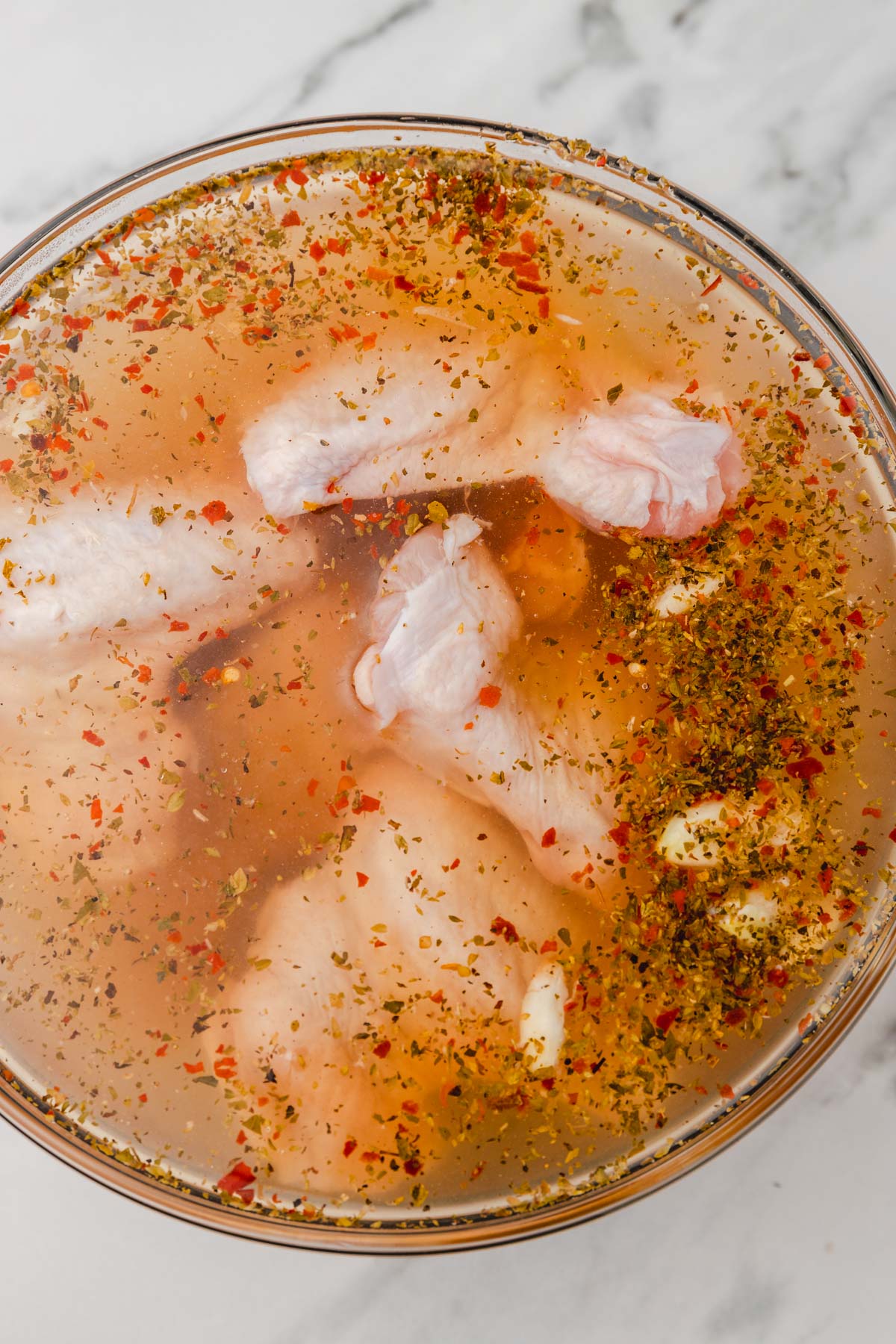 chicken wings in bath of brine.