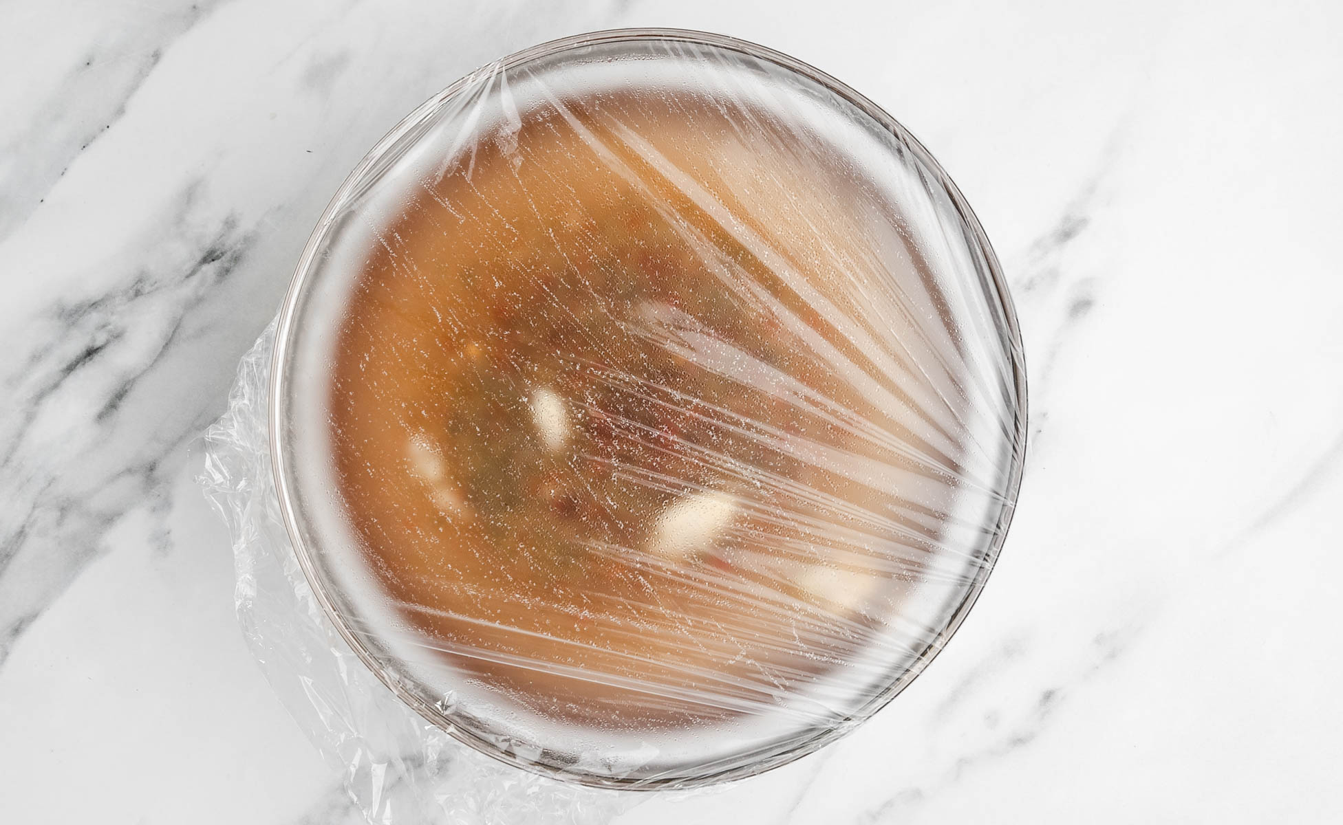 cling film over a bowl.