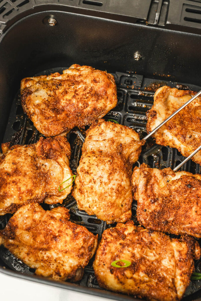 seven crispy boneless chicken thighs in the air fryer.